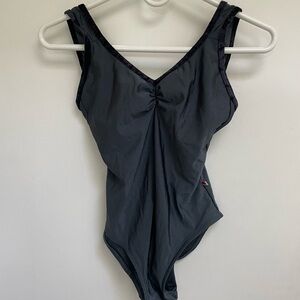 Yumiko leotard. Tiffany in titanium nylon with a velvet black trim.